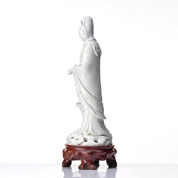 A blanc de chine figure of Guanyin and a servant, Qing dynasty, 19th Century.