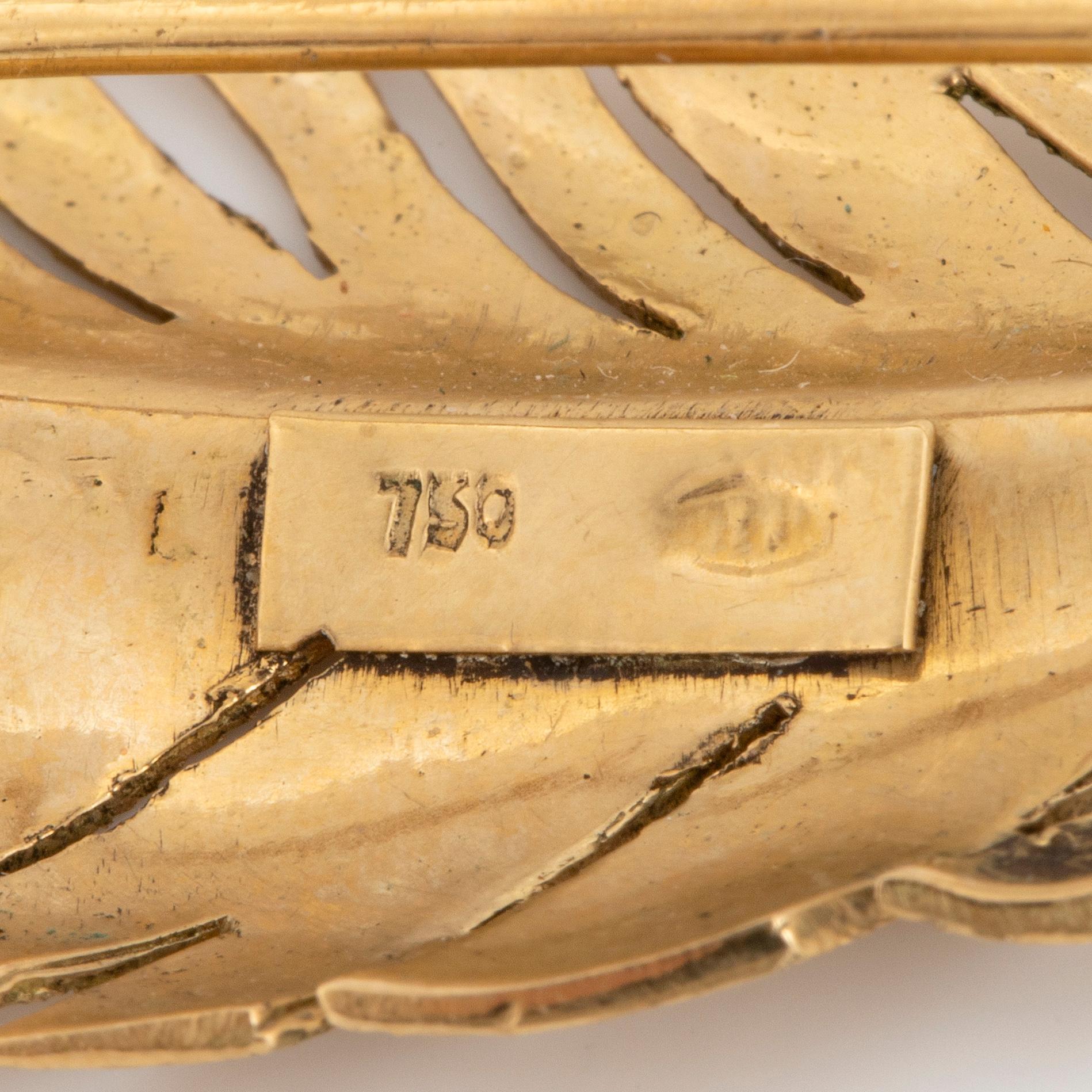 18K gold feather brooch.