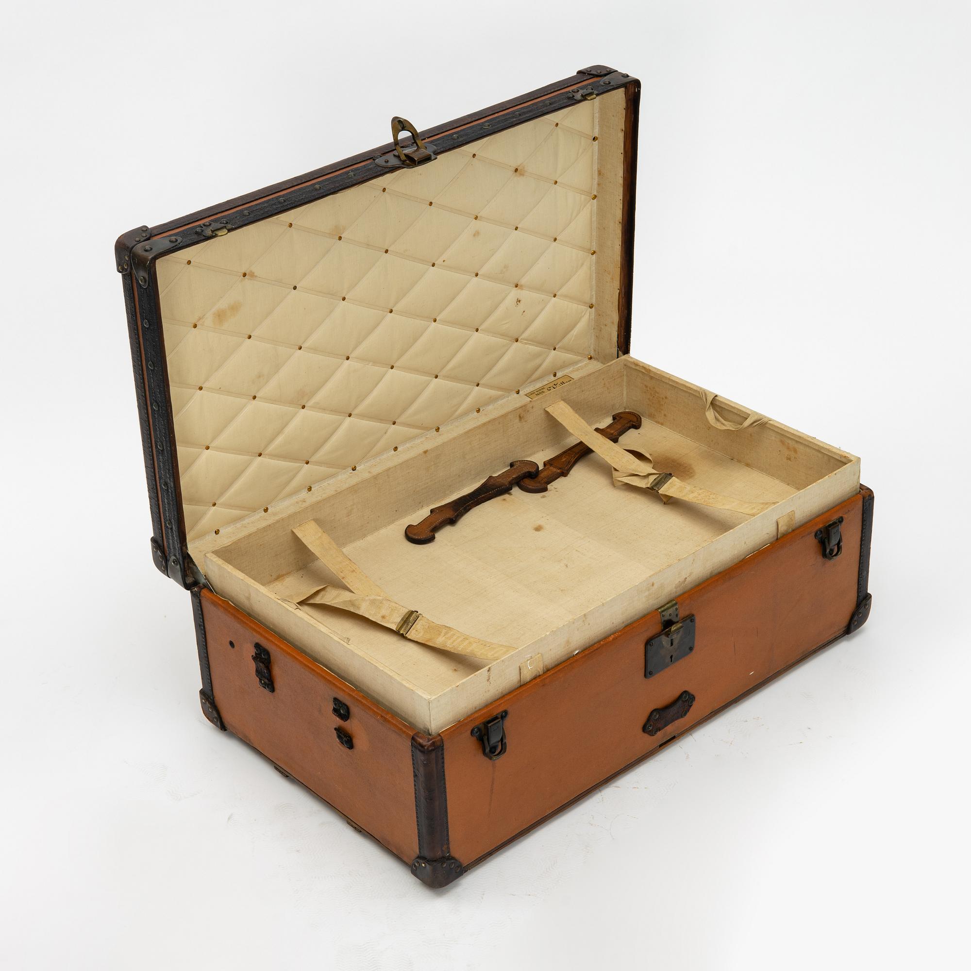 Louis Vuitton, orange Steem Trunk from the early 20th century.