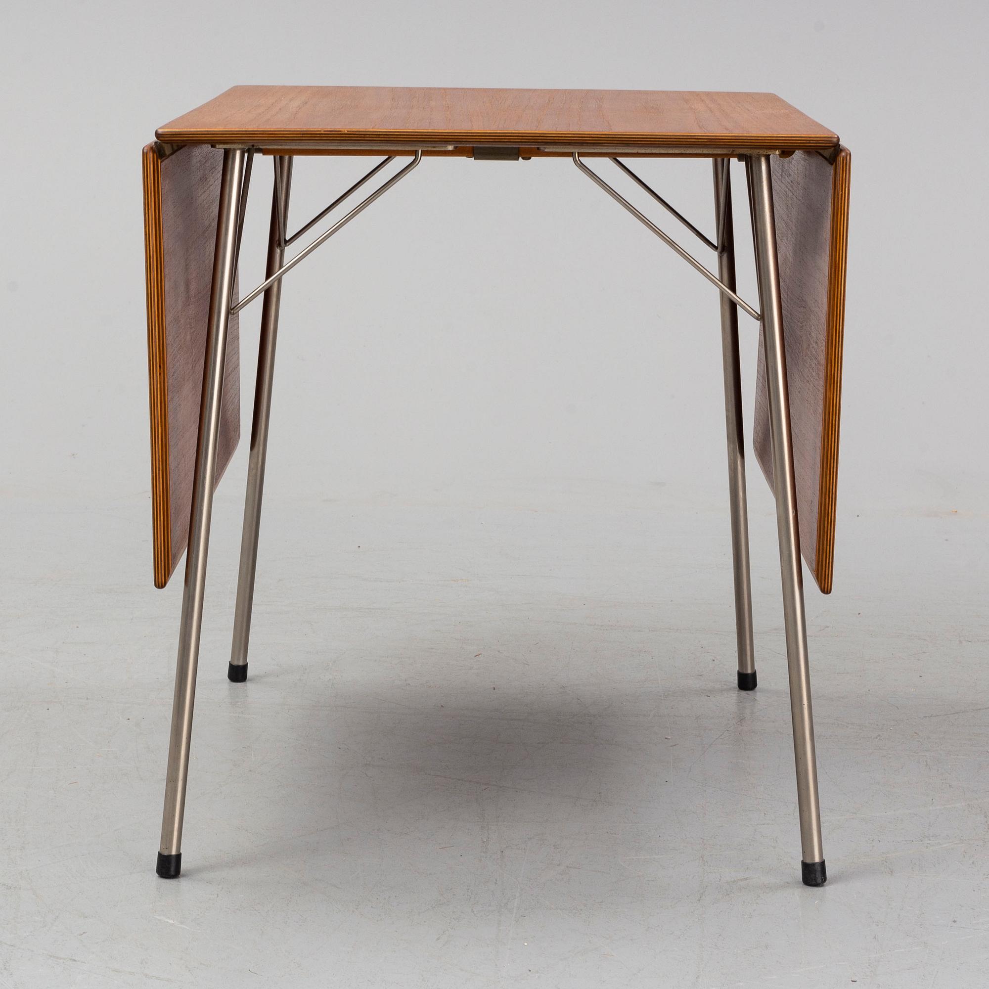 A table by Arne Jacobse, Fritz Hansen, Denmark. Designed 1952-1953.