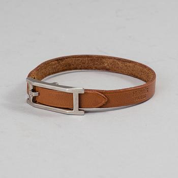 HERMÈS, a scarf and a bracelet.