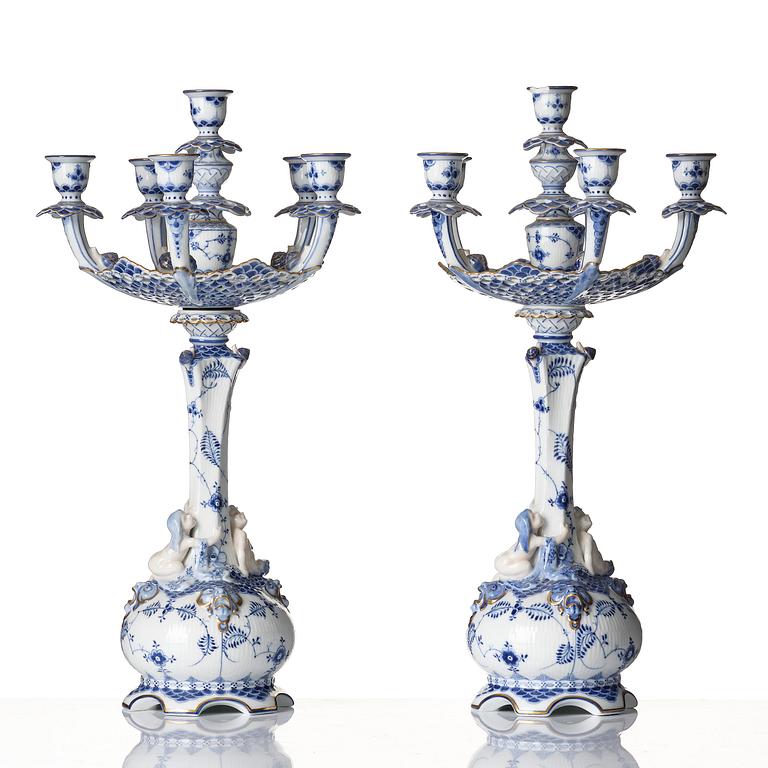 A pair of Royal Copenhagen 'Musselmalet' / 'blue fluted full lace' six-light candelabras, Denmark, 1898-1923.