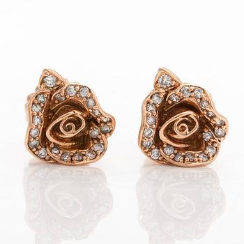 A pair of 14K rose gold earrings with brilliant-cut diamonds.