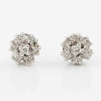 A ring and a pair of earrings in 18K white gold set with round brilliant-cut and octagonal-cut diamonds.