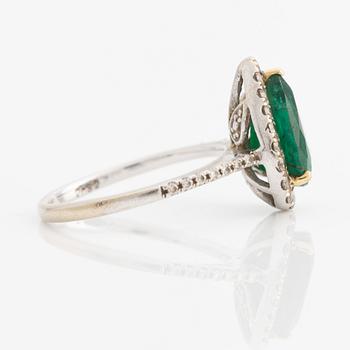 Ring, 18K white gold, with pear-shaped emerald and brilliant-cut diamonds.