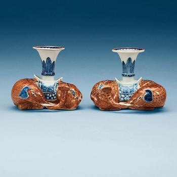 A pair of Export candle sticks in the shape of reclining elephants, Qing dynasty, Qianlong (1736-95).