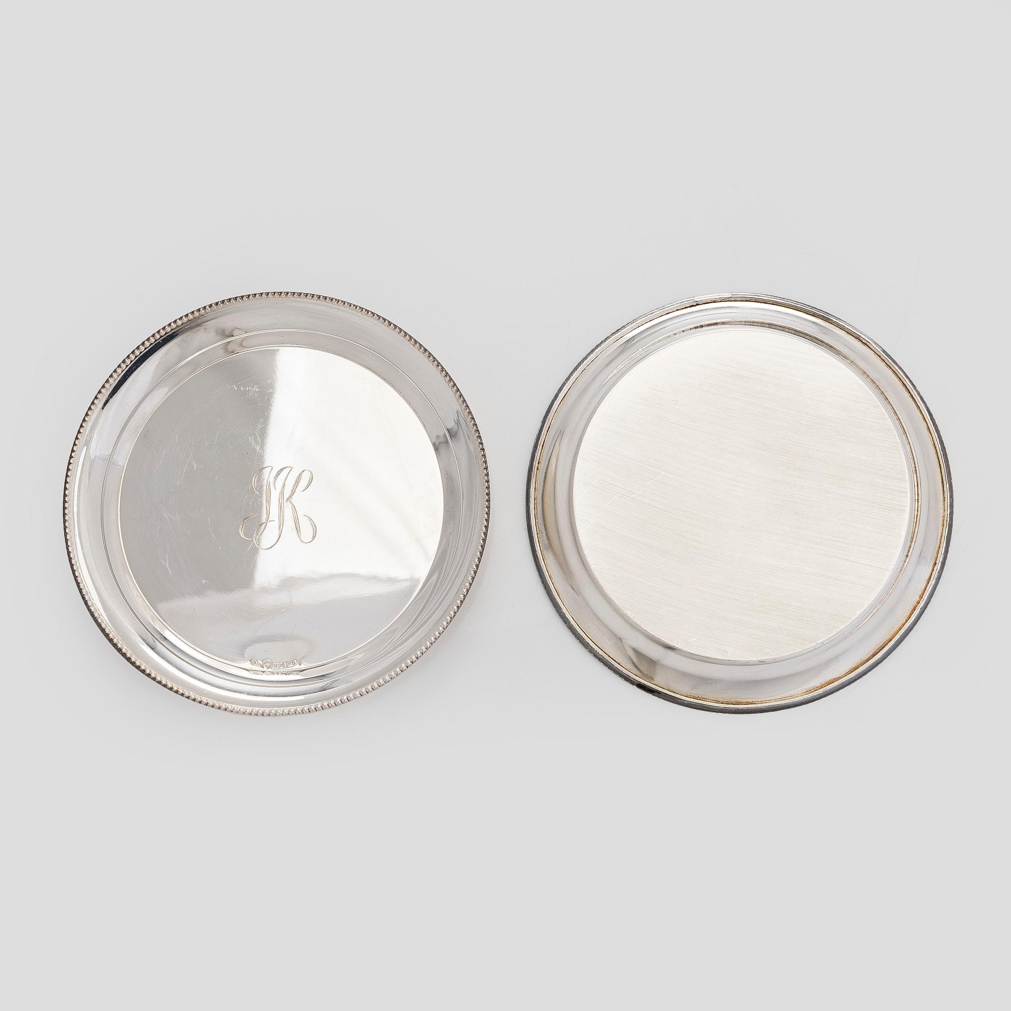 A set of 12 silver glass coasters, Auran Kultaseppä Oy Turku 1935 and 1983, and cocktail sticks, 12 pcs silver.