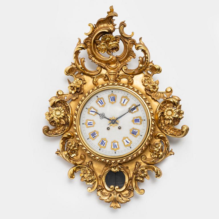 A Rococo style wall clock, first half of the 20th century.
