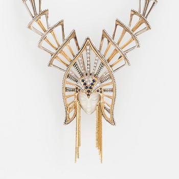 An ERTE necklace with a detachable pendant wearble as a brooch.