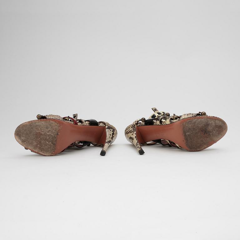 AZZEDINE ALAÏA, a pair of sandalettes with patent leather straps.