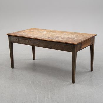 A 19th Century table with drawers.