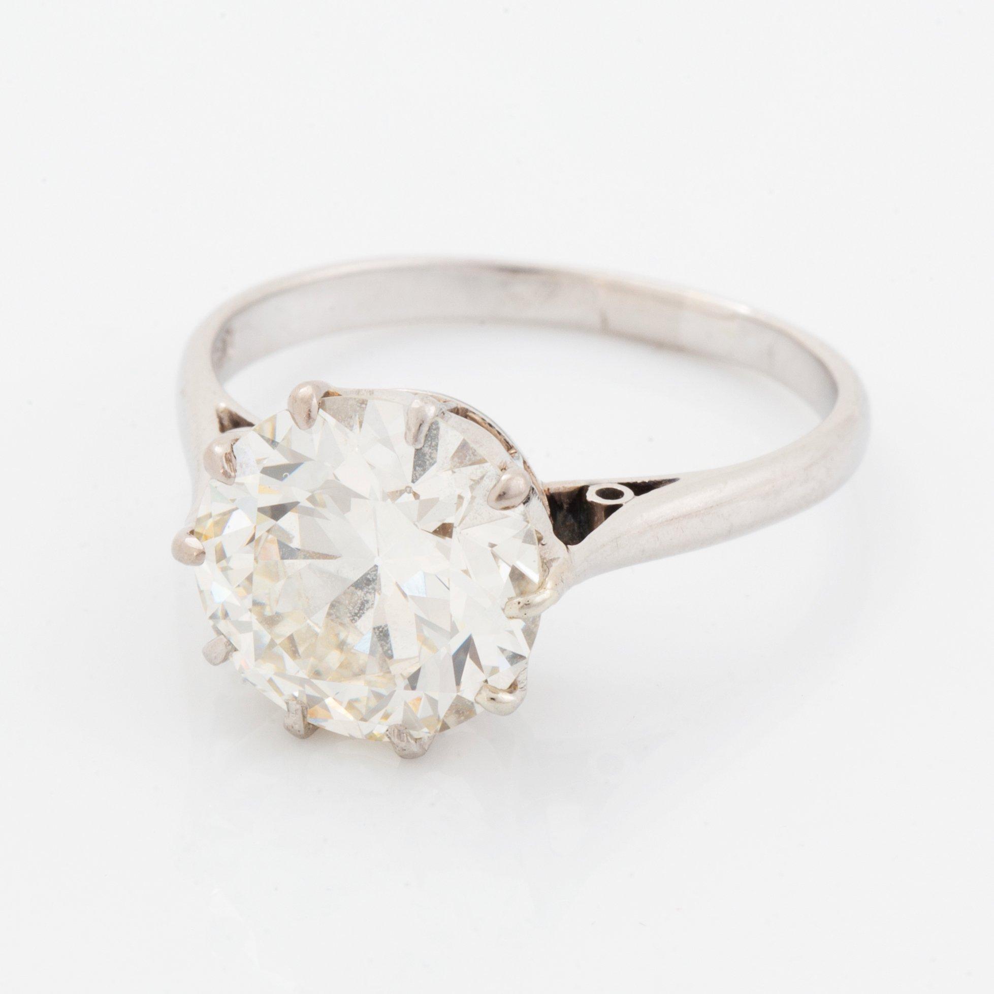 A platinum ring set with an old-cut diamond ca 3.30 cts quality ca J/K vs.