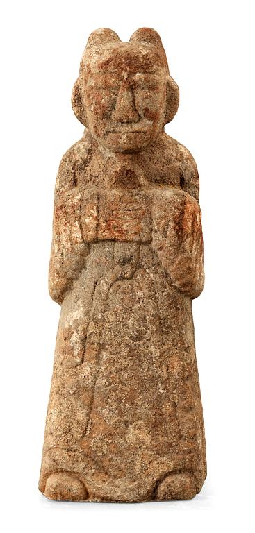 A stone sculpture of a guardian, presumably Han dynasty.