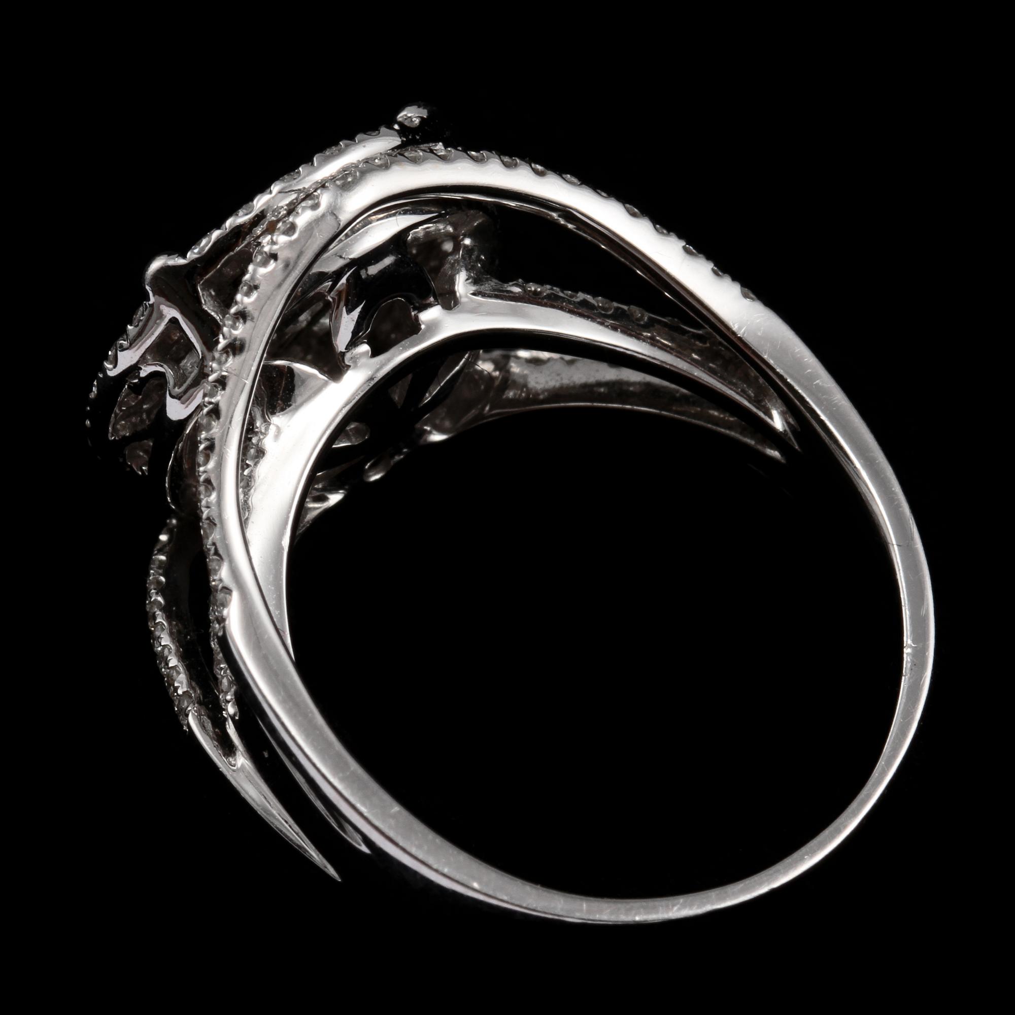 RING, 18k vitguld, med 128 briljantslipade och 9 prinsesslipade diamanter, tot ca 1.31 ct, 2000-tal. Vikt 6 g.