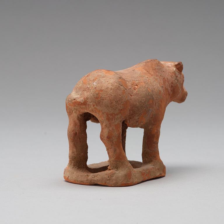 Three pottery scultpures of animals and a herdsman, Tang dynasty (618-906).