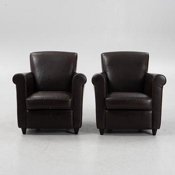 A pair of leather upholstered easy chairs, end of the 20th Century.