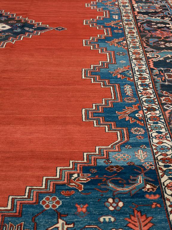 A CARPET, an antique Bakshaish, ca 693 x 398,5 cm, dated "1298"AH/1880 AD probably.