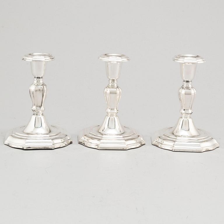 A set of three Swedish silver candlesticks, maker's mark CG Hallberg, Stockholm 1955-1957.