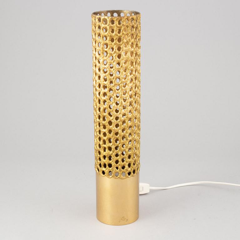 A brass table lamp by Pierre Forssell, second half of the 20th Century.