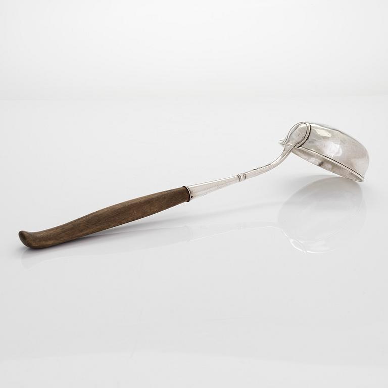 A silver ladle and cream jug,Johan Illberg, Viborg 1852, and unidentified master from Moscow, 1843.