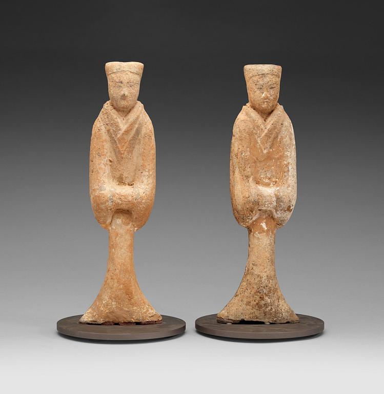 A pair of potted tomb figures of a guardiens, Han dynasty (206 B.C. - 220 A.D.).