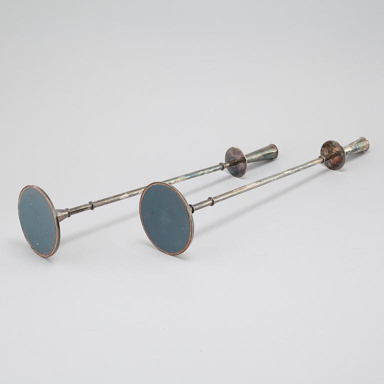 A pair of silver candelsticks by Tore Eldh, K&EX, Gothenburg, 1962.