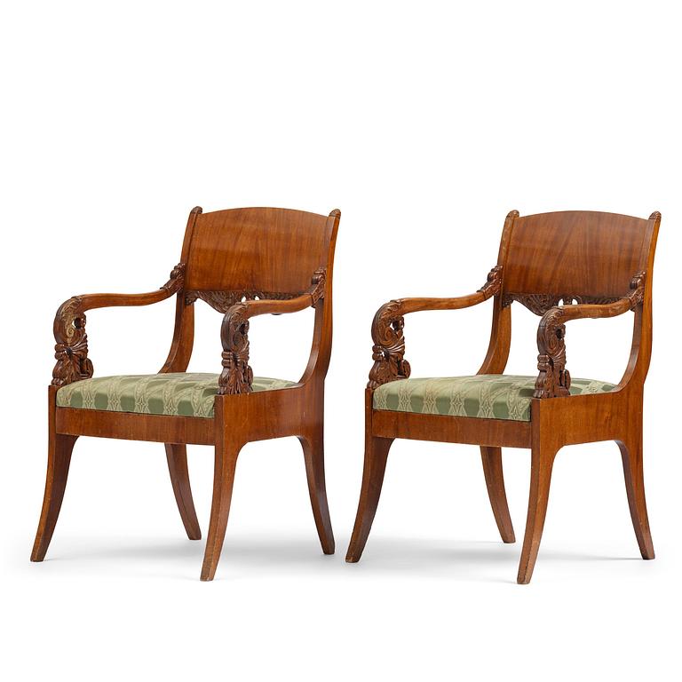 A pair of Baltic / Russian mahogany Empire armchairs, first part 19th century.