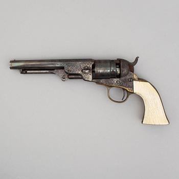 A Colt 1862 Pocket Navy percussion revolver with ivorygrip.