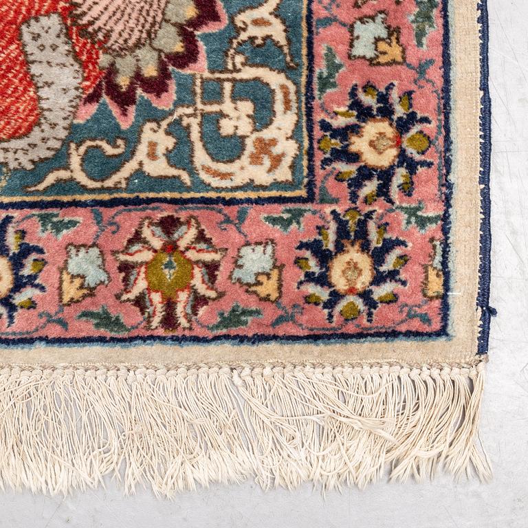 A carpet, a semi-antique Tabriz figural, ca 354,5-362 x 250,5-258 cm.