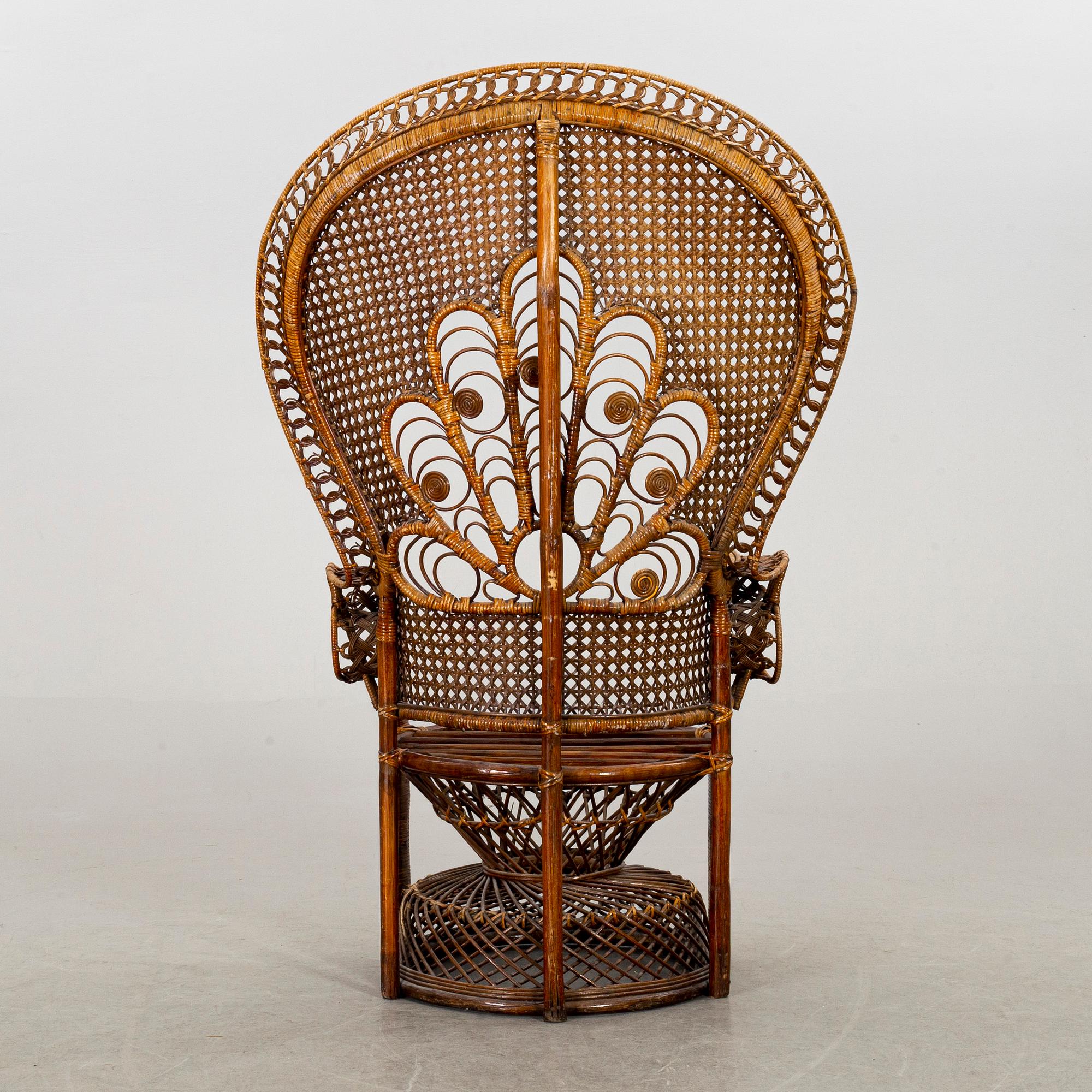 A RATTAN ARMCHAIR.