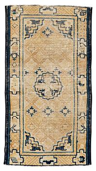 A RUG, an antique Ningxia, China, late Qing, ca 130 x 70,5 cm.