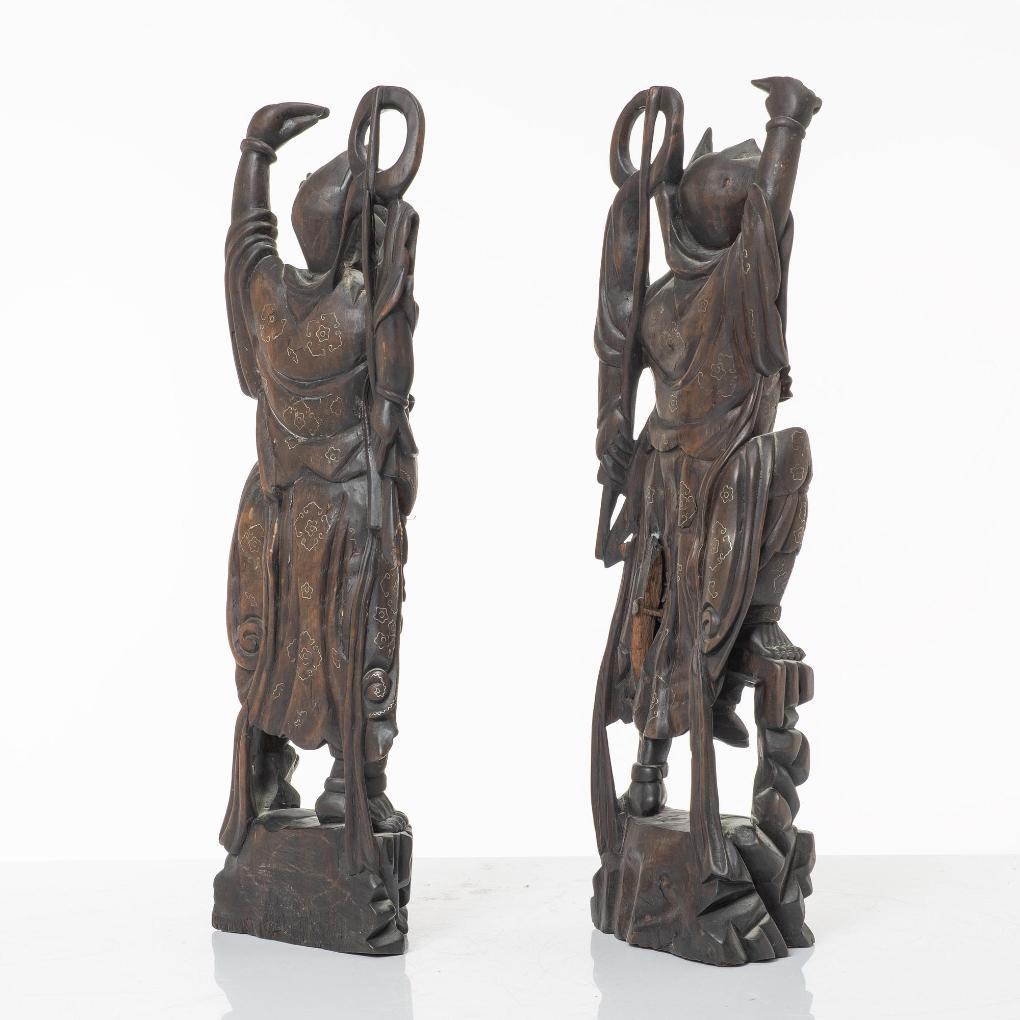 A pair of Chinese hardwood figures, 20th century.