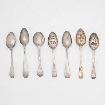 Seven silver spoons, including English and Swedish hallmarks.
