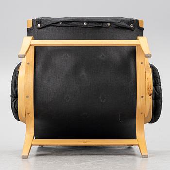 Bruno Mathsson, a 'Pernilla' armchair, Dux, Sweden, later part of the 20th century.