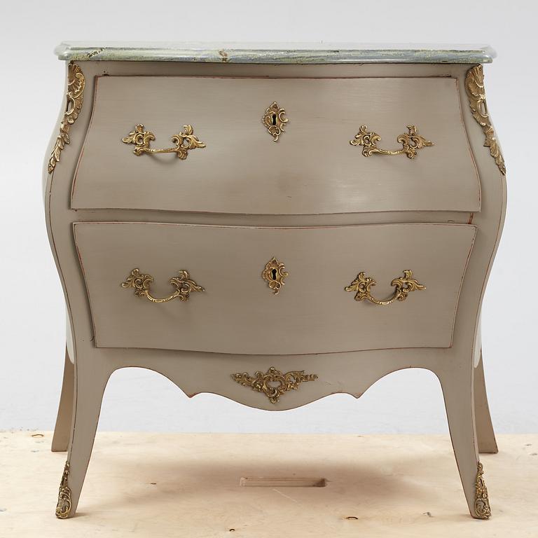 A mid 20th century rococo-style chest of drawers.