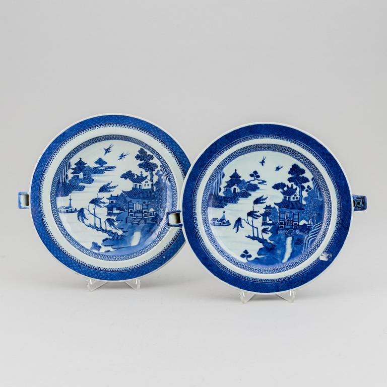 A pair of blue and white hot water dishes, Qing dynasty, Jiaqing (1796-1820).