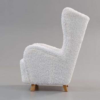 An upholstered easy chair, probably by Mogens Lassen, Denmark 1930's-40's.