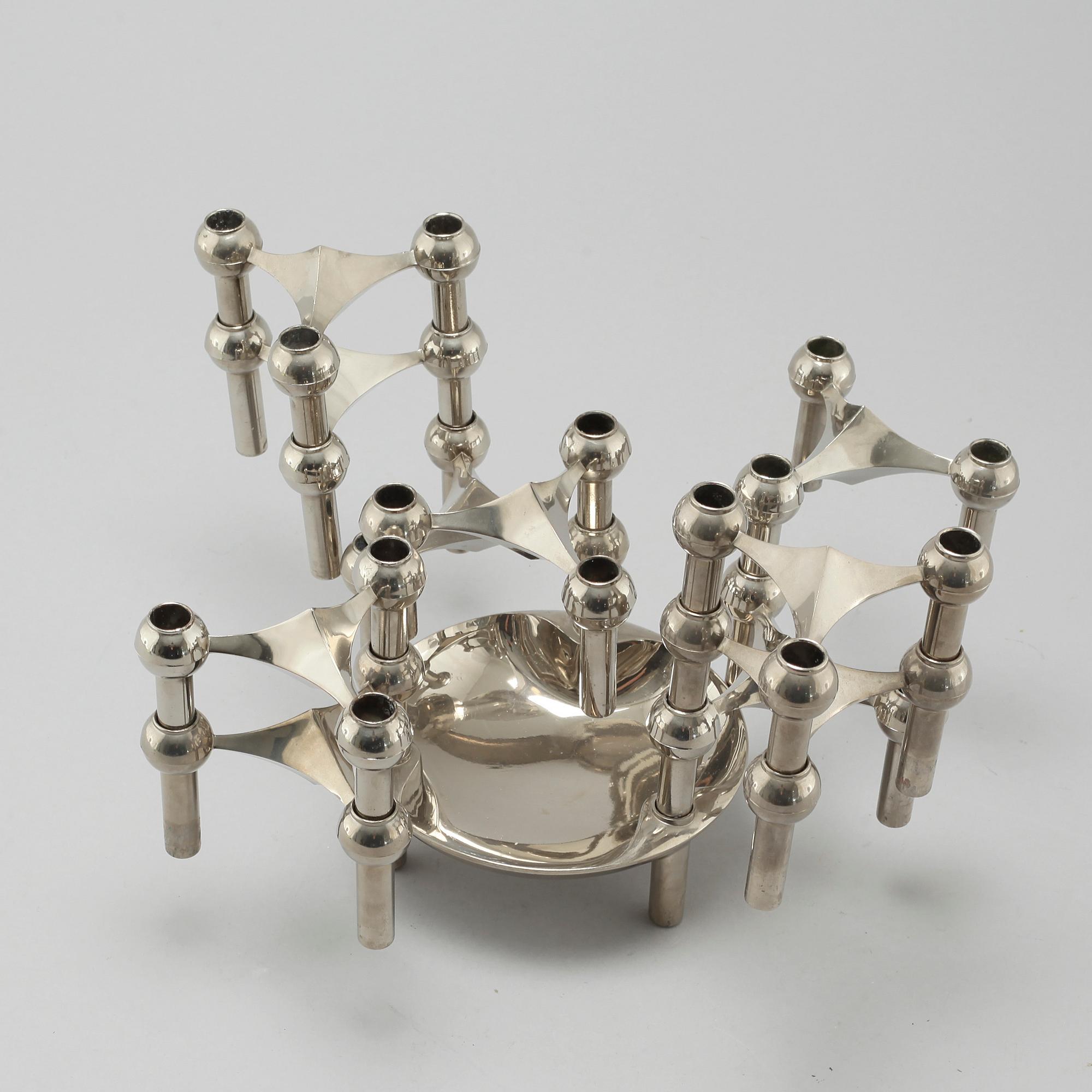 A metal candlestick with eleven parts by Ceasar Stoffi and Fritz Nagel, second half of the 20th century.