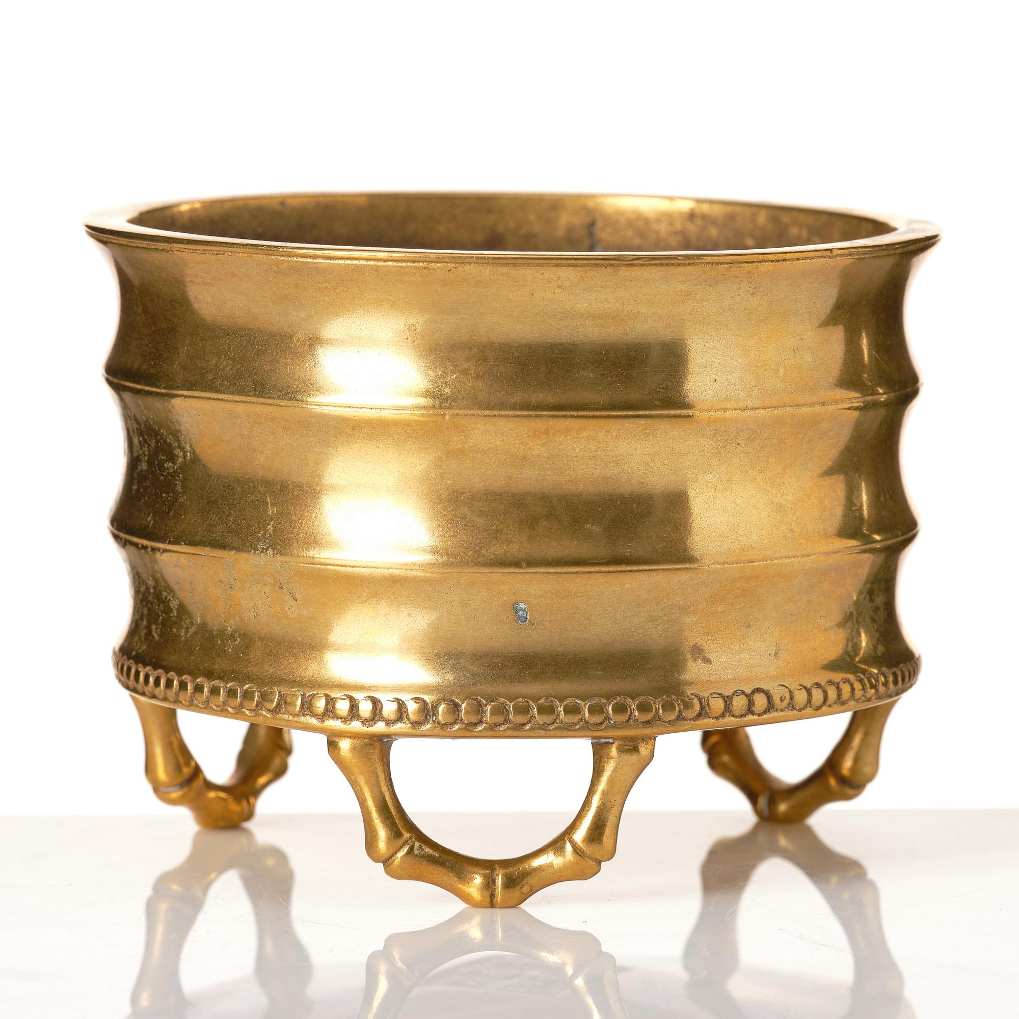 A gilt bronze tripod censer, Qing dynasty, possibly 18th Century.
