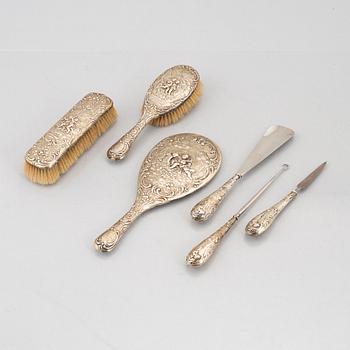 A German Silver Rococo-Style Dressing Set, early 20th Century (6 pieces).