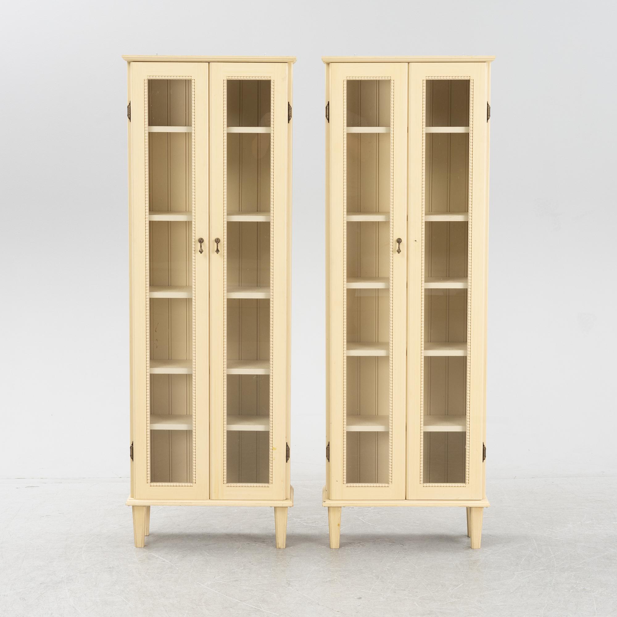 A pair of Gustavian style book cabinets, 21st century.