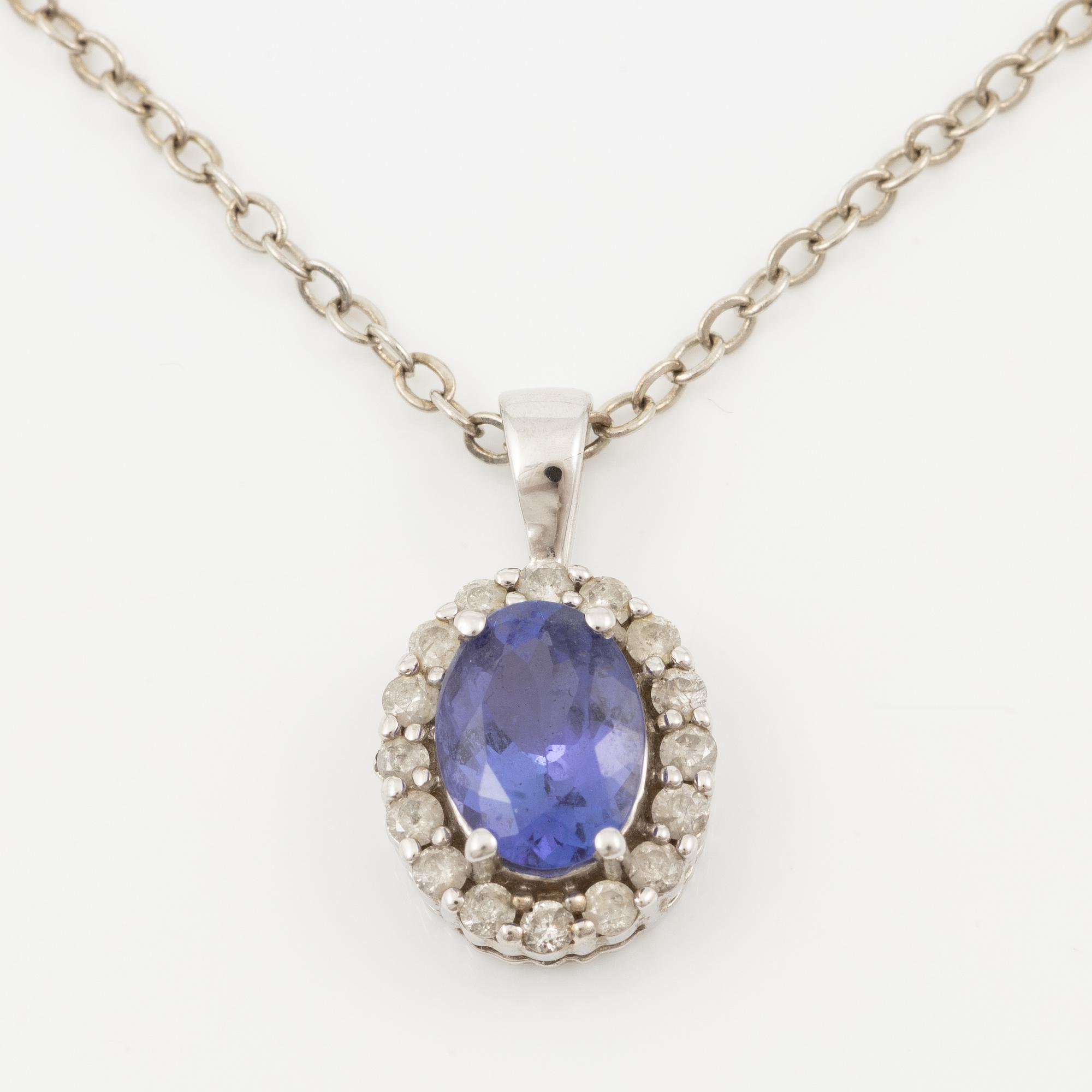 Pendant in 14K white gold set with a faceted tanzanite and round brilliant-cut diamonds.