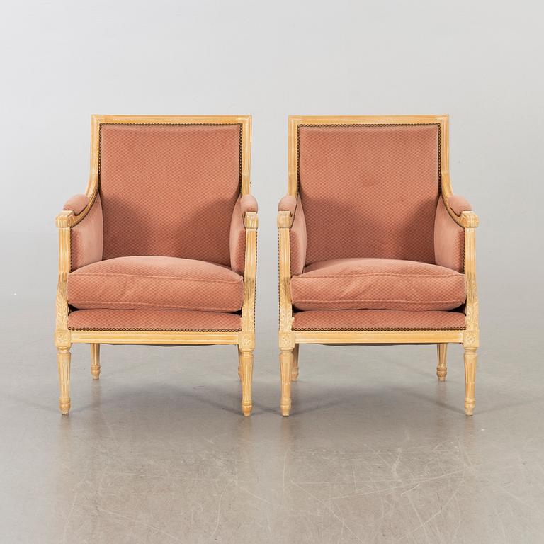 A pair of 20th century gustavian style armchairs.