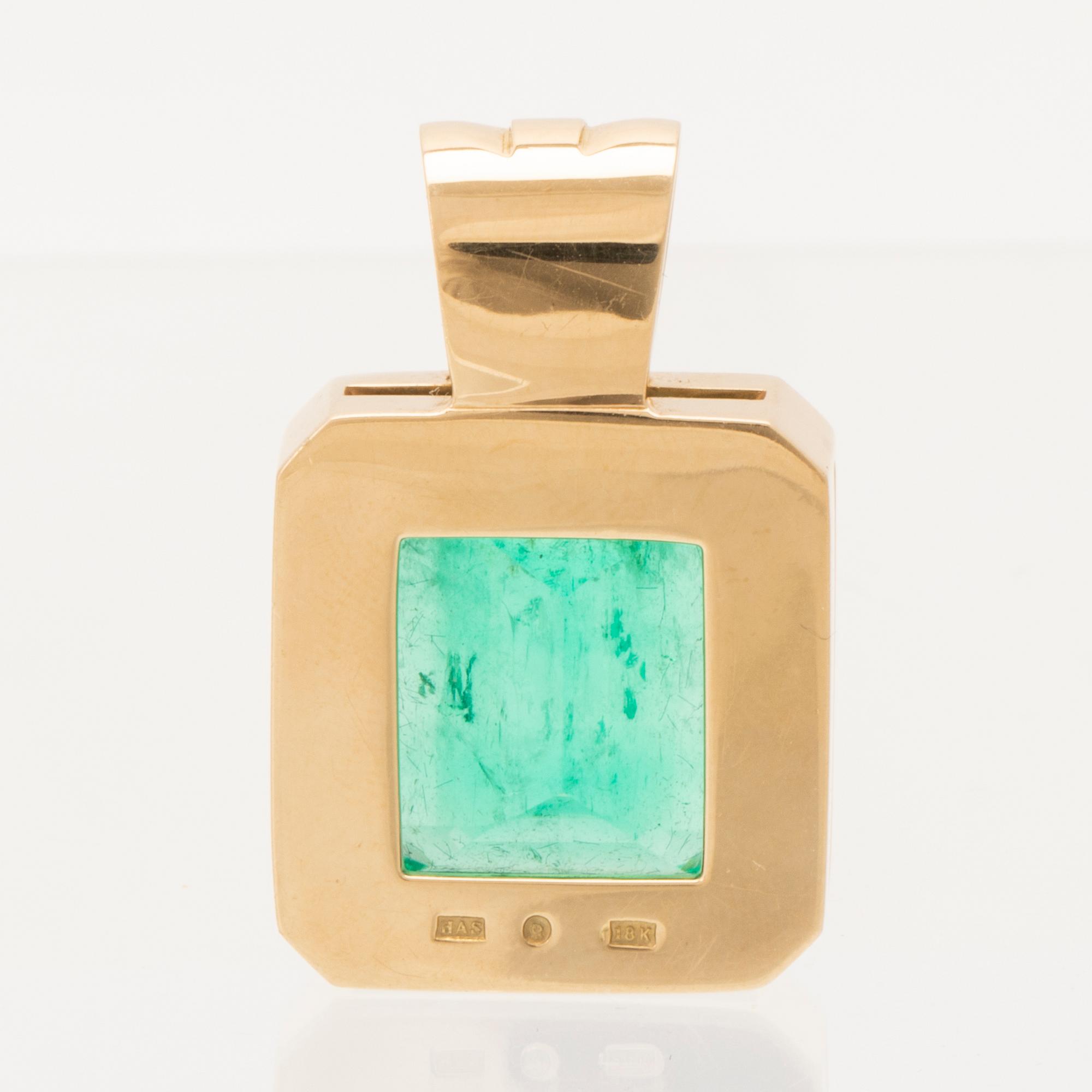 An 18K gold pendant set with an emerald-cut emerald, Schrittesser Gold & Silversmith Gothenburg.
