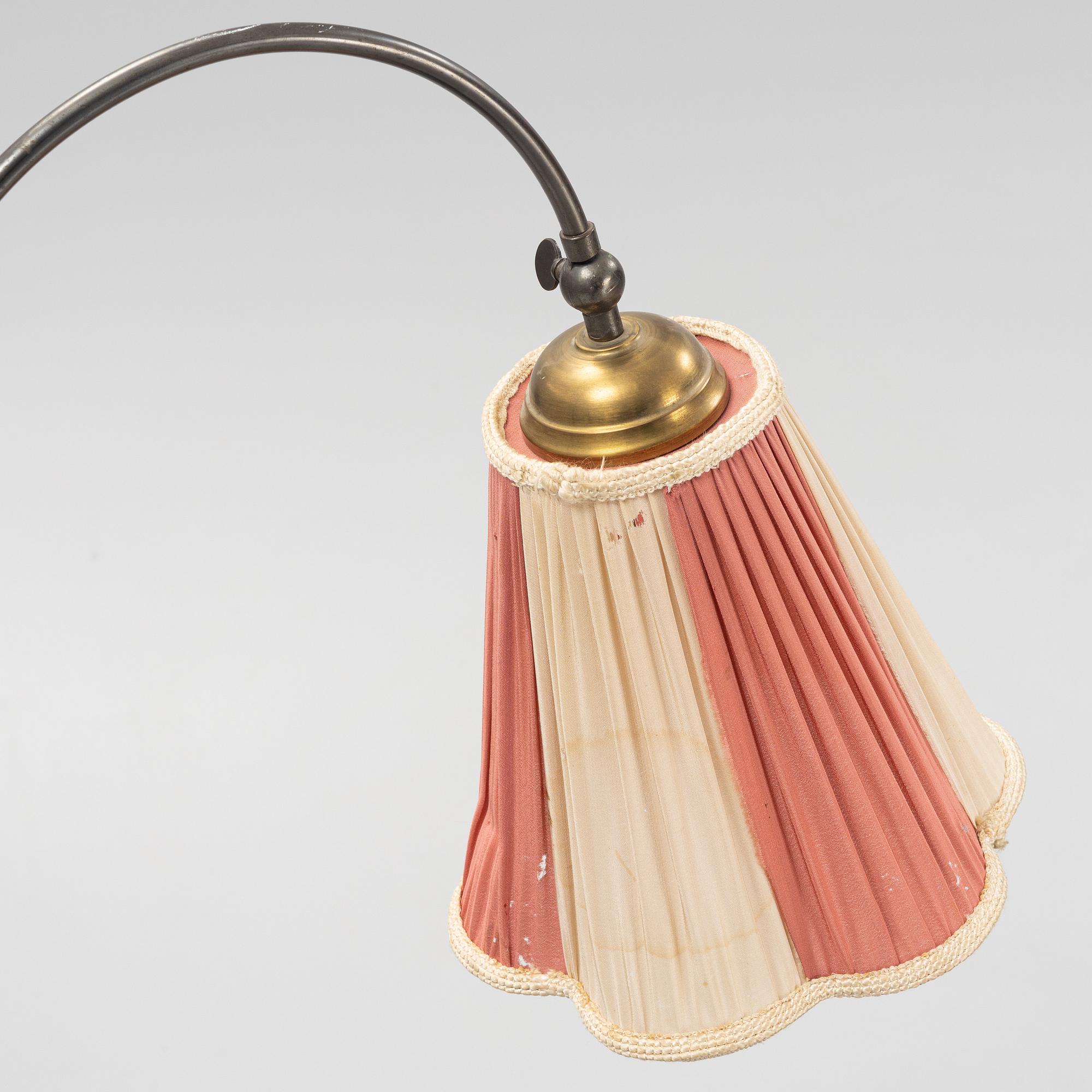 A painted side table with lamp, first half of the 20th Century.