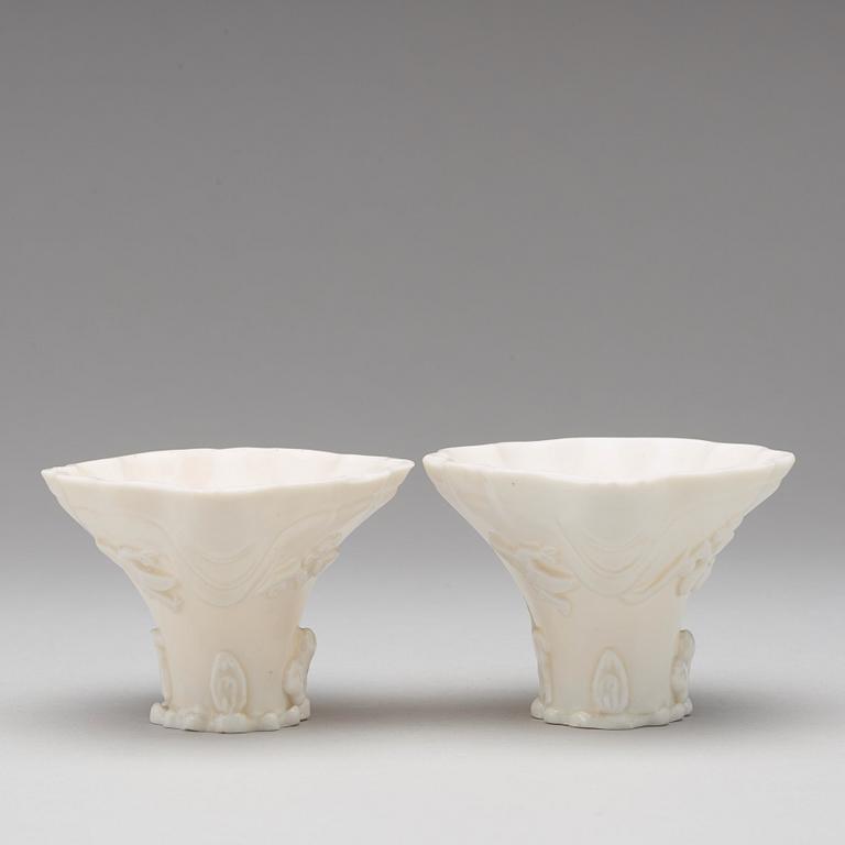 Two blanc de chine rhinoserous shaped libation cups, Qing dynasty, Kangxi (1662-1722).