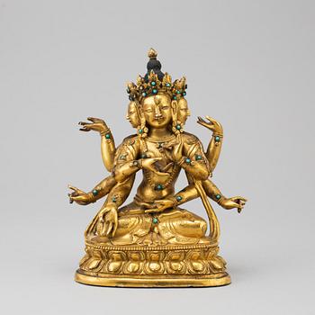 A Sino-Tibetan gilt copper alloy figure of Ushnisha Vinaya, late 18th century/circa 1800.