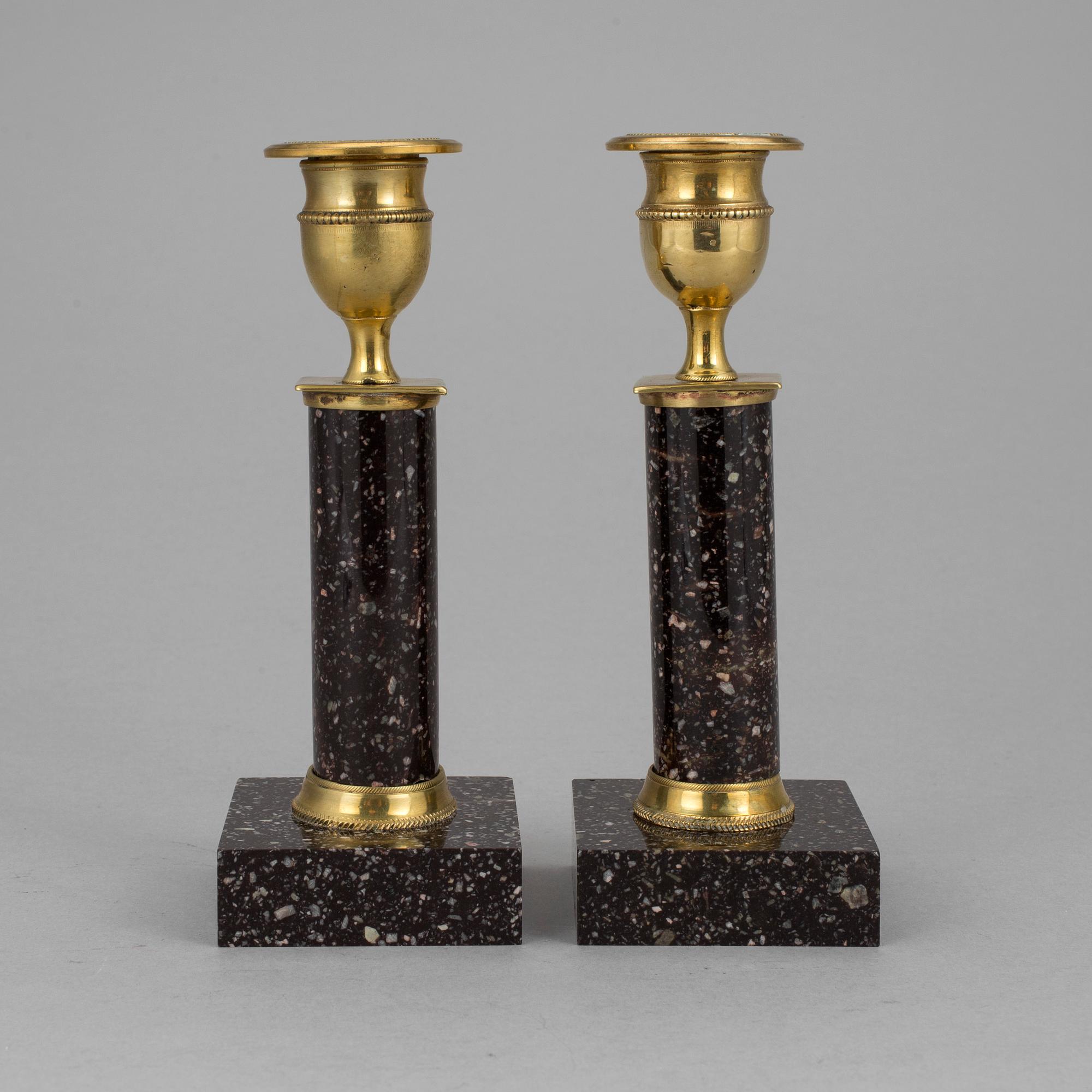 A pair of late gustavian porphyry candle sticks early 19th century.