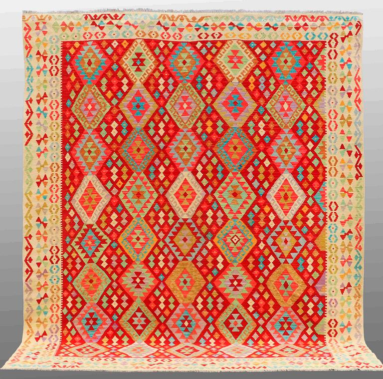 A CARPET, Kilim, ca 297 x 257 cm.