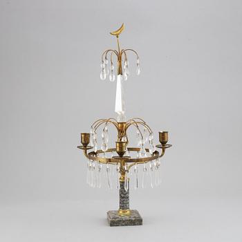 A gustavian style three-light girandole, first half of the 20th century.